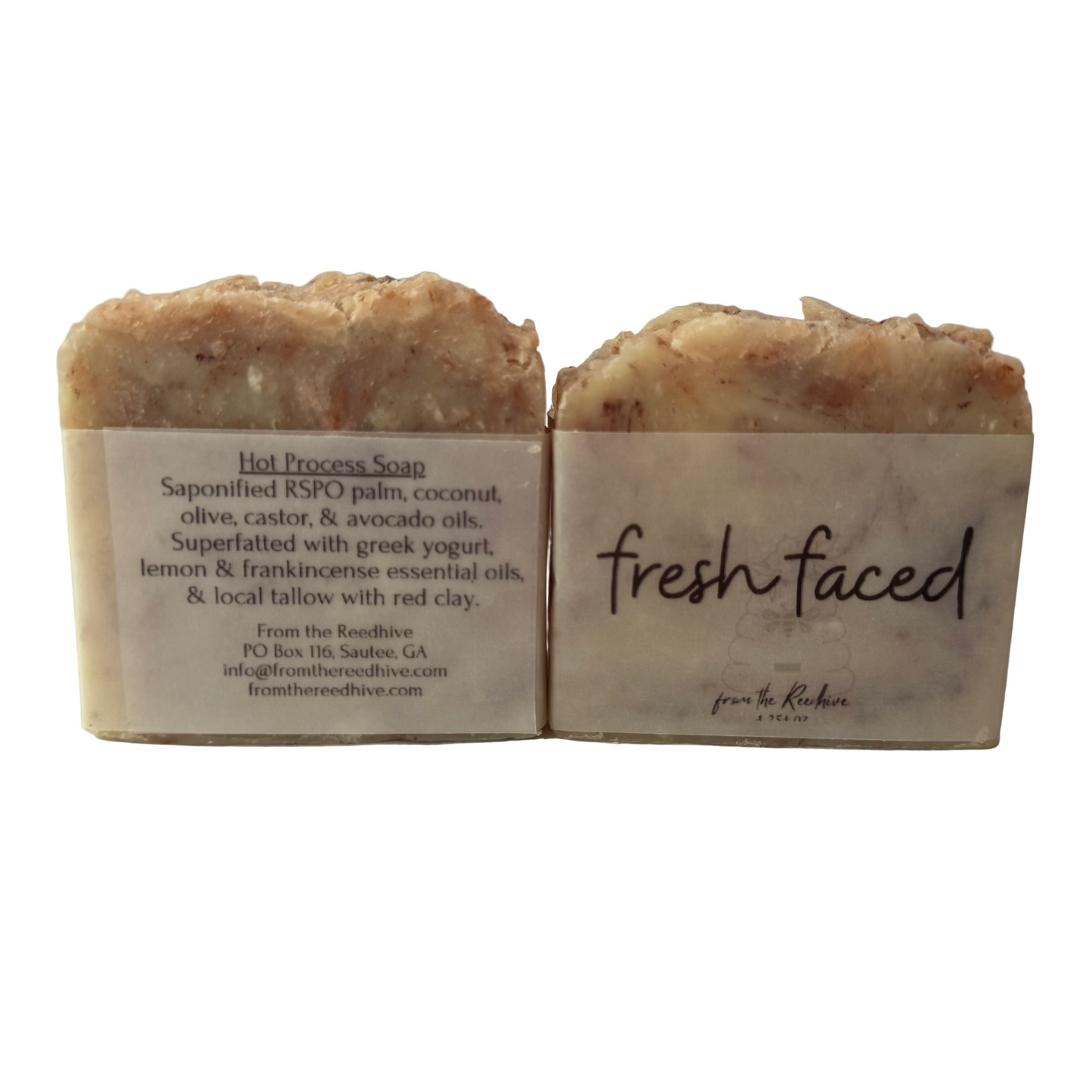Two bars of soap with labels on a light background